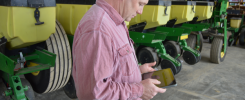 Organic farmer Scott Myers checks his field profitability on his iPad.